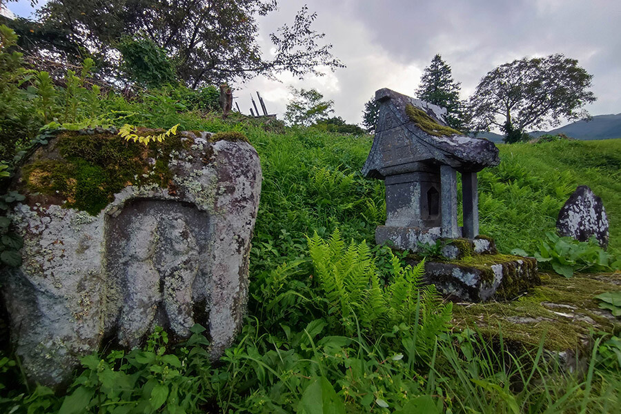 Stone shrine and Dosojin (roadside deities)